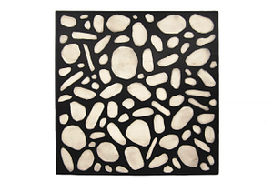 A square wood panel with raised black paint around circular shapes that expose the wood.