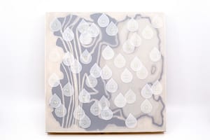 Image description: An artwork is veiled with a removable frosted Dura-lar film sleeve, blurring the painting behind. Small removeable teardrop shapes, also made of Dura-lar film, have Braille words scattered on the sleeve.