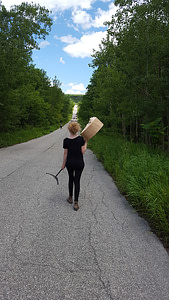 Olivia carrying the landmarks 2017 sculpture to its next exhibit location in Rouge National Park
