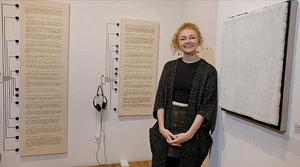 I am standing in the middle of my exhibition,"The Scales That Fall From Our Eyes".