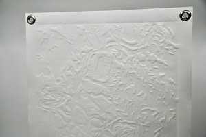 A detail image of a white square paper is embossed with textures of organic shapes.