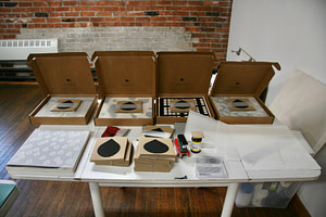 An image of four CONTACT kits in a row with components of the kit in front.