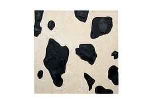Image description: A square wood panel with wax in between thick blobs of black paint.